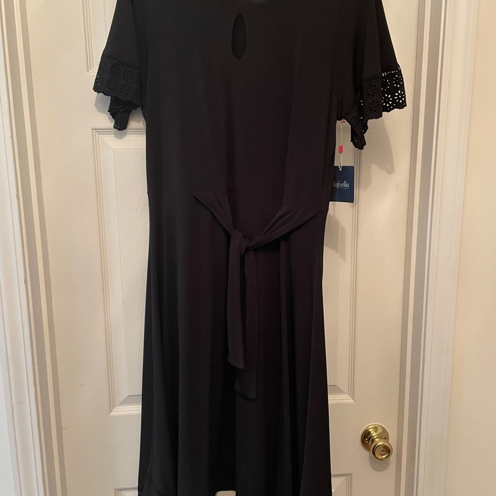 Rafaella, XL, has handkerchief hem, lace edging on the sleeves